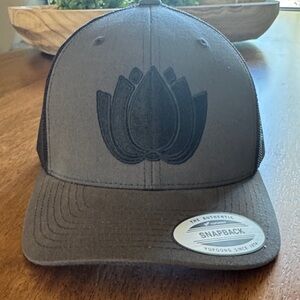 The Classic Black & Gray Snapback Hat with Lotus Emblem